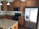 This kitchen offers granite countertops, stainless steel appliances, ample cabinet space, and a functional kitchen island at 115 Ballyliffen Ln, Cary, NC 27519