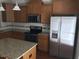 This kitchen offers granite countertops, stainless steel appliances, ample cabinet space, and a functional kitchen island at 115 Ballyliffen Ln, Cary, NC 27519
