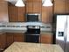 Kitchen features stainless steel appliances, granite countertops, and ample cabinet space with great natural light at 115 Ballyliffen Ln, Cary, NC 27519