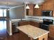 Open kitchen featuring an island, stainless steel appliances, and ample cabinet space perfect for cooking and entertaining at 115 Ballyliffen Ln, Cary, NC 27519