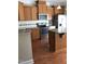 Well-equipped kitchen features stainless steel appliances, granite countertops, and a central island for meal prep at 115 Ballyliffen Ln, Cary, NC 27519