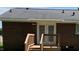 Brick back exterior with french doors leading to outdoor deck and stairs at 1210 Fayetteville St, Smithfield, NC 27577
