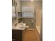 Bright bathroom features a tub, vanity, and open shelving for a modern aesthetic at 1210 Fayetteville St, Smithfield, NC 27577