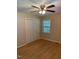 Bedroom features closet, a window, wood-look flooring and ceiling fan with light at 1210 Fayetteville St, Smithfield, NC 27577