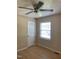 Bedroom with natural light and wood-look flooring, a door to the left adds privacy at 1210 Fayetteville St, Smithfield, NC 27577