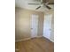 Bedroom features wood-look floors, and two bright white doors, one to a closet at 1210 Fayetteville St, Smithfield, NC 27577