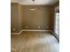Empty dining room featuring wood floors, and a modern light fixture at 1210 Fayetteville St, Smithfield, NC 27577