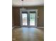 Dining area with french doors leading to outdoor deck and light fixture at 1210 Fayetteville St, Smithfield, NC 27577