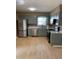 Spacious kitchen features stainless steel appliances, gray cabinets, and modern countertops at 1210 Fayetteville St, Smithfield, NC 27577