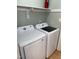 Bright white Samsung washer and dryer set with gray accents in a laundry area at 1210 Fayetteville St, Smithfield, NC 27577