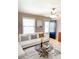 Cozy living room with white sofa, decorative pillows, and modern decor elements at 1210 Fayetteville St, Smithfield, NC 27577