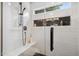 New tiled shower stall featuring shower niche, modern shower head, and glass door at 1218 Chimney Hill Dr, Apex, NC 27502