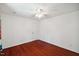 Bright bedroom with hardwood floors, ceiling fan, and white walls at 1218 Chimney Hill Dr, Apex, NC 27502