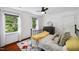 Cozy bedroom featuring natural light, hardwood floors, and neutral decor at 1218 Chimney Hill Dr, Apex, NC 27502