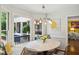 Sunlit breakfast nook features a banquette and modern pendant lighting at 1218 Chimney Hill Dr, Apex, NC 27502