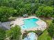 Aerial shot of a community pool with lap lanes, lounge chairs, and a separate pool at 1218 Chimney Hill Dr, Apex, NC 27502