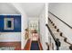 Entryway features hardwood floors, staircase, and view into the dining room, creating an inviting welcome at 1218 Chimney Hill Dr, Apex, NC 27502