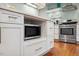 Stylish kitchen island with a built-in microwave and ample storage at 1218 Chimney Hill Dr, Apex, NC 27502