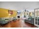 Bright living room featuring fireplace, hardwood floors, recessed lighting and French doors at 1218 Chimney Hill Dr, Apex, NC 27502