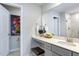 Bright bathroom featuring quartz countertop, decorative fixtures, and a mirror over the vanity at 1227 Bessie Ct, Wake Forest, NC 27587