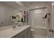Bright bathroom features a shower and tub combination, decorated vanity, and stylish finishes at 1227 Bessie Ct, Wake Forest, NC 27587