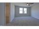 Spacious bedroom with neutral gray carpet, a ceiling fan, and a closet at 1227 Bessie Ct, Wake Forest, NC 27587