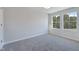 Bedroom with ample natural light, neutral walls, and plush carpeting at 1227 Bessie Ct, Wake Forest, NC 27587
