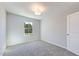 Cozy bedroom featuring gray carpet and white walls and door at 1227 Bessie Ct, Wake Forest, NC 27587