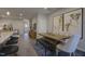 Open-concept dining area featuring a wooden table, modern decor, and stylish seating at 1227 Bessie Ct, Wake Forest, NC 27587