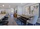 Open-concept dining area featuring a wooden table, modern decor, and stylish seating at 1227 Bessie Ct, Wake Forest, NC 27587
