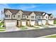 Charming townhome exteriors featuring multiple units and a community atmosphere in a residential neighborhood at 1227 Bessie Ct, Wake Forest, NC 27587