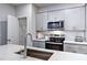 Modern kitchen with stainless steel appliances and a walk-in pantry at 1227 Bessie Ct, Wake Forest, NC 27587