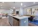 Open concept kitchen featuring a center island with stainless steel appliances, and pendant lighting at 1227 Bessie Ct, Wake Forest, NC 27587
