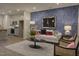 Stylish living room open to a modern kitchen, complete with contemporary furnishings and decor at 1227 Bessie Ct, Wake Forest, NC 27587