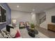 Comfortable living room with modern decor, plush seating, and beautiful accent wall design at 1227 Bessie Ct, Wake Forest, NC 27587