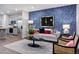 Stylish living room with accent wall, modern furniture, and bright lighting at 1227 Bessie Ct, Wake Forest, NC 27587