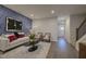 Stylish living room with blue accent wall, modern furnishings, and hardwood flooring at 1227 Bessie Ct, Wake Forest, NC 27587