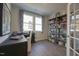 Inviting home office with ample natural light and custom shelving for organization and décor at 1227 Bessie Ct, Wake Forest, NC 27587
