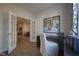 Bright home office featuring french doors, natural light, and workspace at 1227 Bessie Ct, Wake Forest, NC 27587