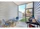 Cozy screened patio with seating area, perfect for outdoor relaxation at 1227 Bessie Ct, Wake Forest, NC 27587