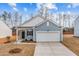 New construction featuring a two-car garage, stylish siding, and a well-maintained front lawn at 1257 Pond Overlook Drive, Nashville, NC 27856