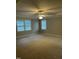 Spacious bedroom with neutral carpet, large windows, ceiling fan, and crown molding at 126 Riverglade Dr, Clayton, NC 27527