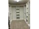 Walk-in closet with carpet and plenty of shelving and hanging space at 126 Riverglade Dr, Clayton, NC 27527