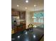 Gourmet kitchen with a large island, granite countertops, stainless steel appliances, and custom cabinetry at 126 Riverglade Dr, Clayton, NC 27527
