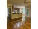 Inviting living room with hardwood floors, a breakfast bar, and views of the kitchen and dining area at 126 Riverglade Dr, Clayton, NC 27527