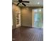 Relaxing screened-in porch features a ceiling fan, and provides access to the backyard at 126 Riverglade Dr, Clayton, NC 27527