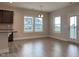 Bright dining area featuring large windows with backyard views and modern flooring at 13 Knotty Pine Lane, Clayton, NC 27520