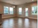 Well-lit dining area showcases large windows overlooking backyard and access to the exterior at 13 Knotty Pine Lane, Clayton, NC 27520