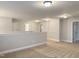 Upstairs hallway showing the stairs, neutral walls, and carpet in a new home at 13 Knotty Pine Lane, Clayton, NC 27520