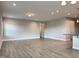 Open-concept living room featuring neutral paint, recessed lighting, and modern flooring at 13 Knotty Pine Lane, Clayton, NC 27520